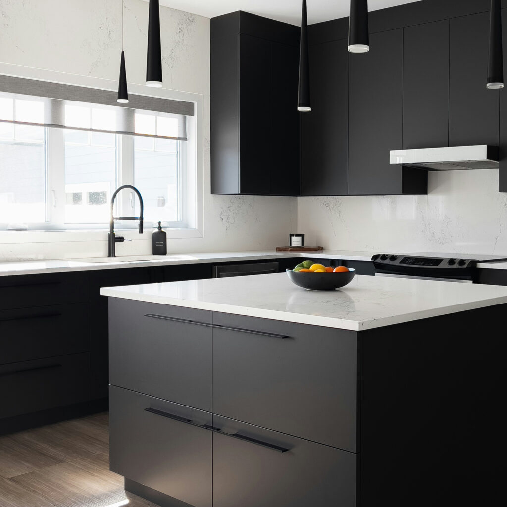 Black Magnet kitchen fitted in Edinburgh with island and modern lighting