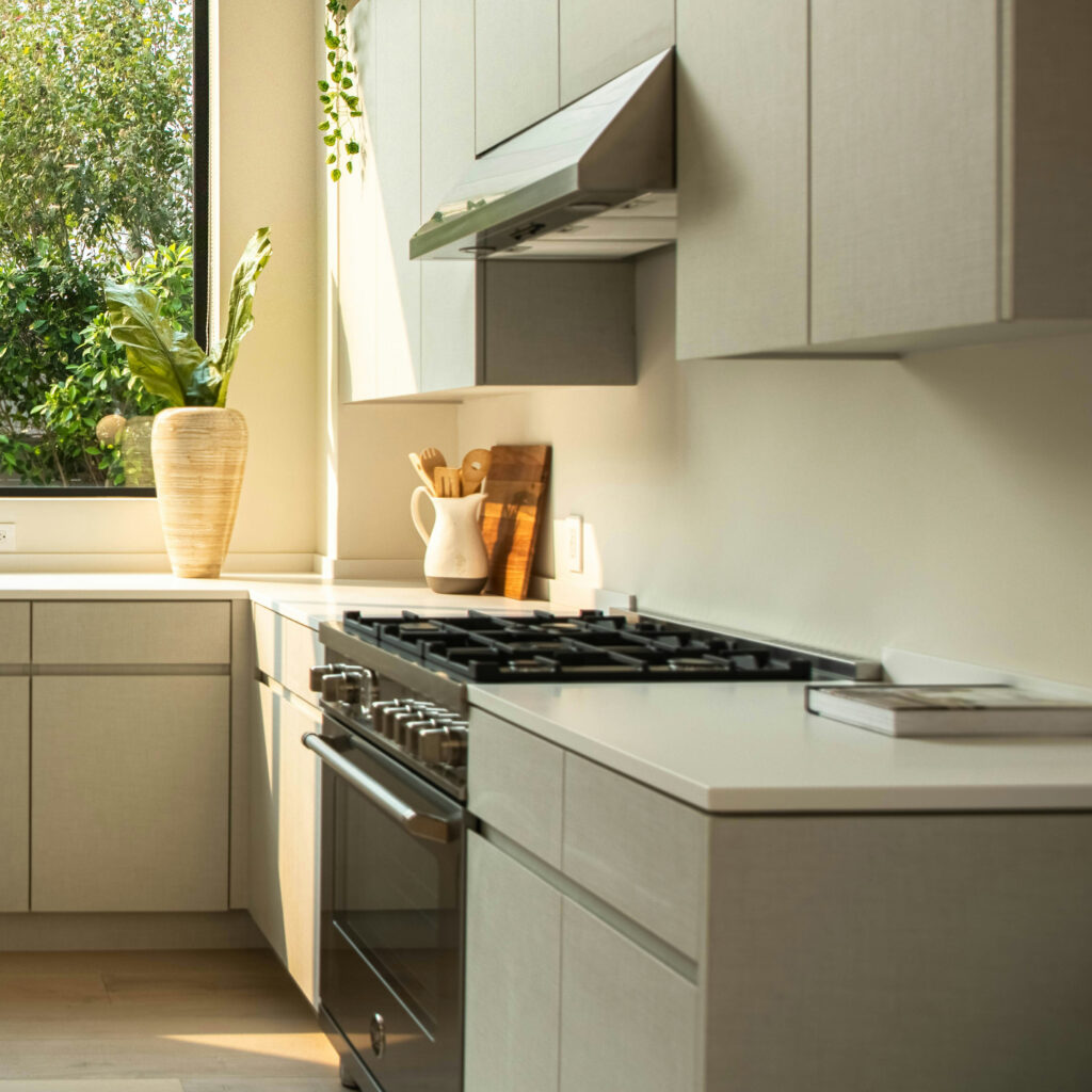 Modern Magnet kitchen installation in Edinburgh with large window and handleless cabinets