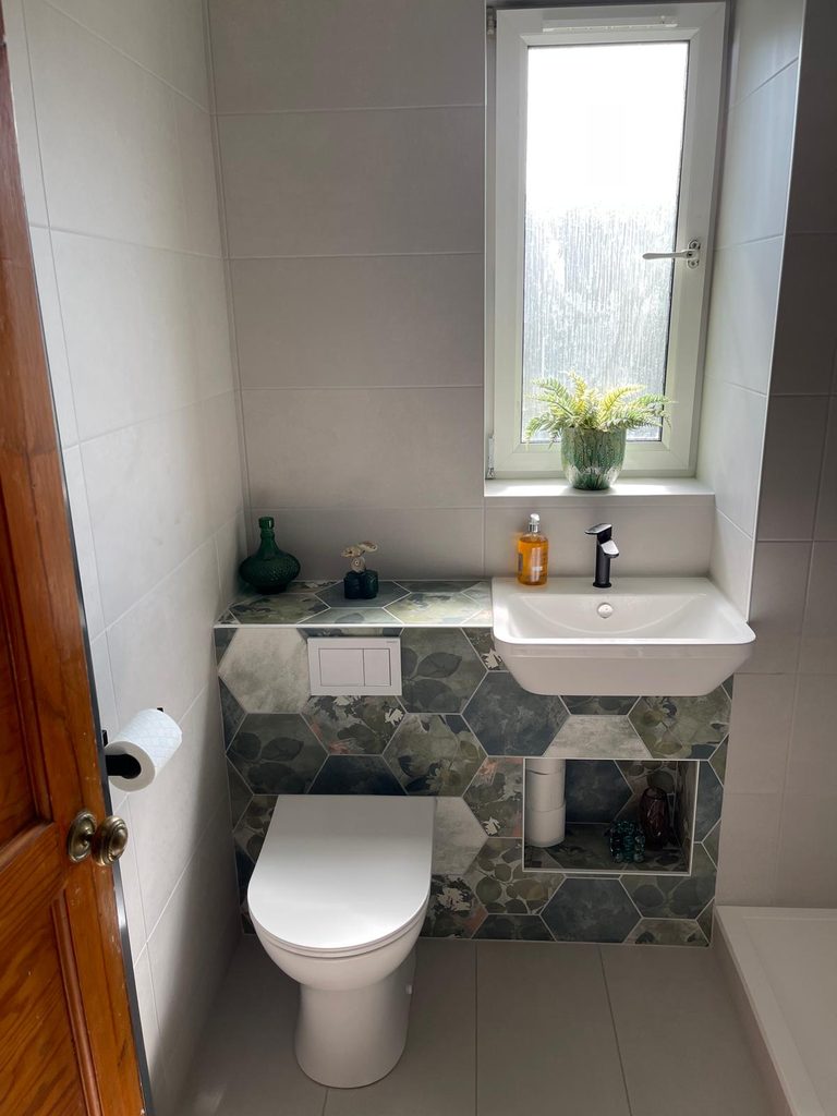 Compact wall-mounted basin and walk-in shower in an Edinburgh bathroom