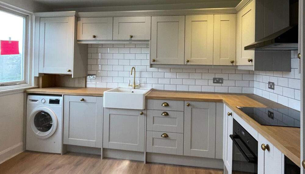 Finished Wren kitchen with Belfast sink and integrated appliances in Edinburgh