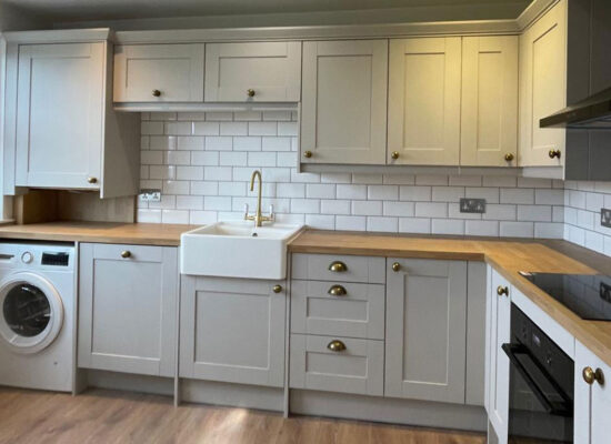Finished Wren kitchen with Belfast sink and integrated appliances in Edinburgh